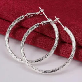 Diamond Cut Hoop Earrings In White Gold